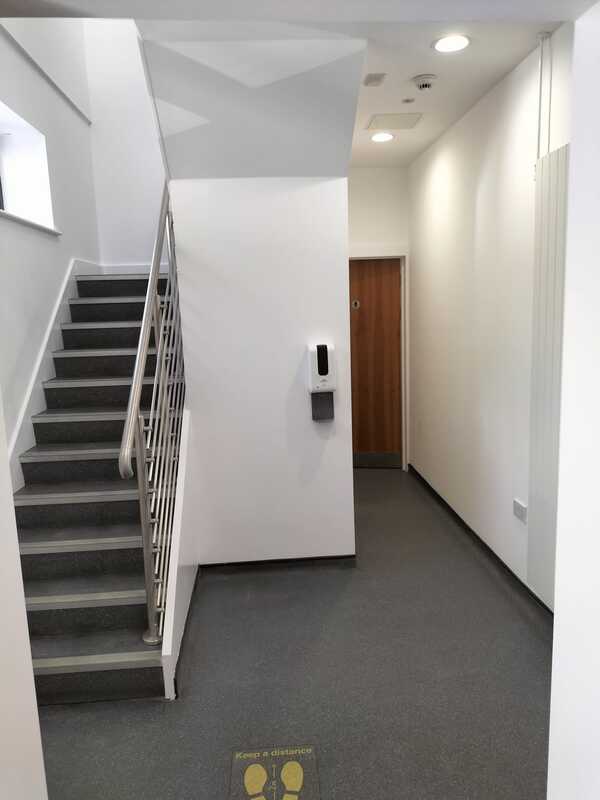 Picture of an office entrance lobby painted white by painters and decorators Nottingham