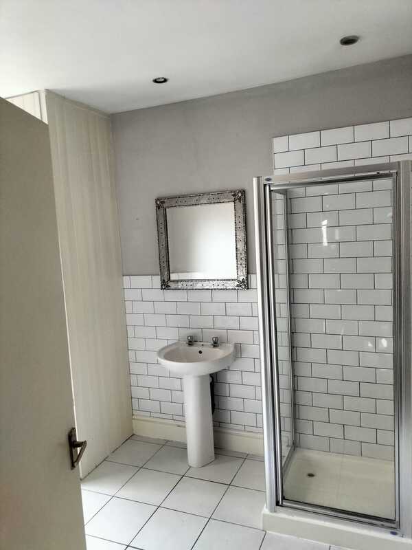 Picture of a bathroom painted light grey by painters and decorators Nottingham