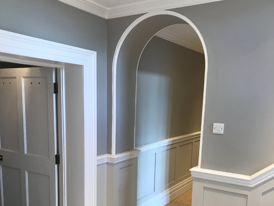 A picture of a hallway painted with grey matte paint by Painters and Decorators Nottingham