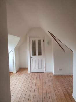Picture of an attic bedroom painted white by Painters and Decorators Nottingham
