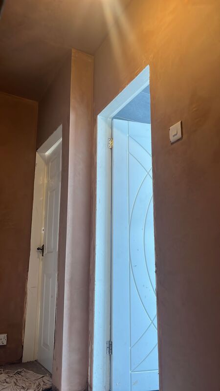 A picture of a freshly plastered hallway by Ard Plasterers Nottingham.