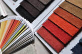 Picture of a colour chart that is being matched up to a furniture colour swatch.